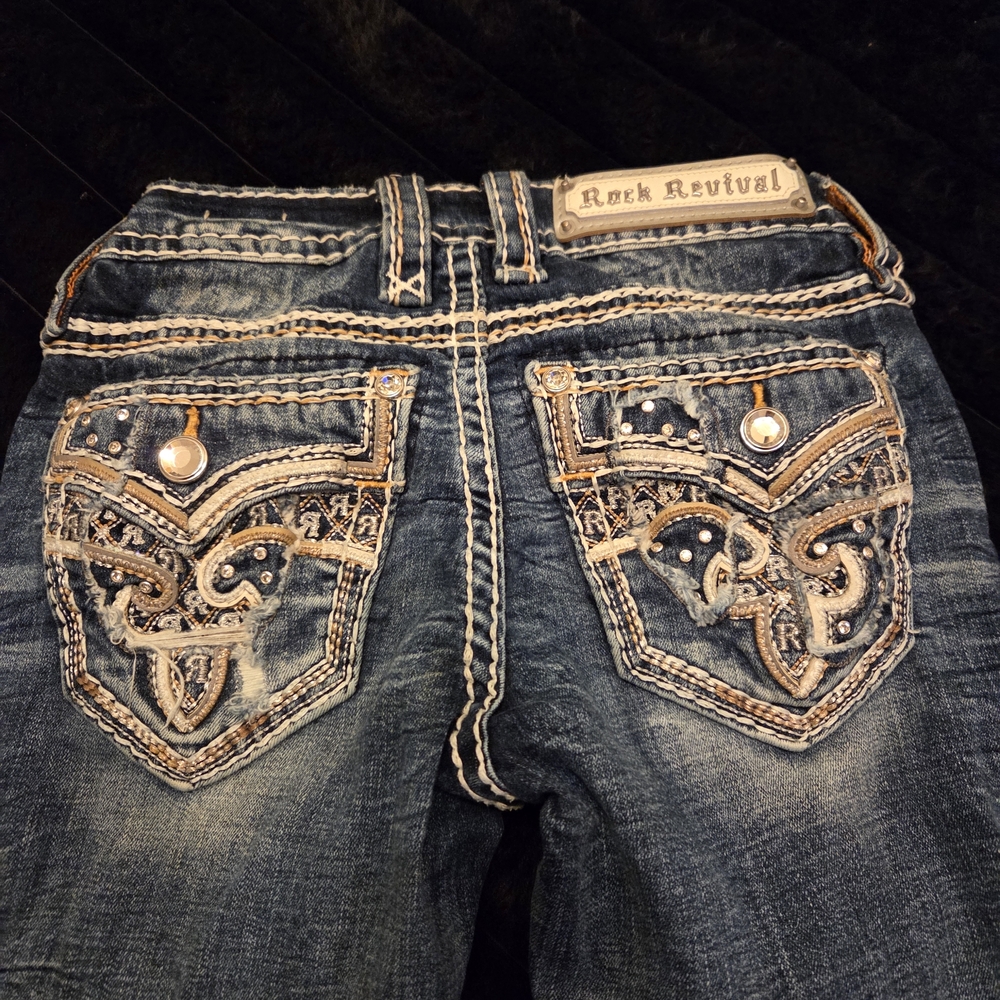 Rock Revival Distressed Blue Jeans with Embellished Pockets